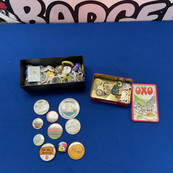Assorted vintage bowling pins and badges in a tin and box.
