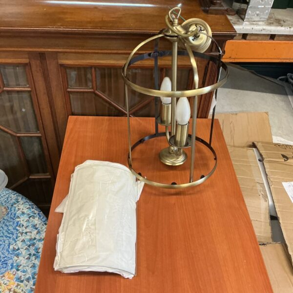 Vintage brass ceiling lantern with glass panels, antique lighting fixture.