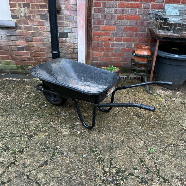 Steel builders wheelbarrow for garden and construction use.