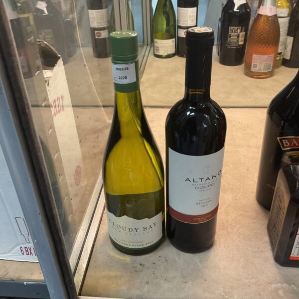 A pair of white wine bottles, Cloudy Bay Sauvignon Blanc and Altano Duro Reserve.