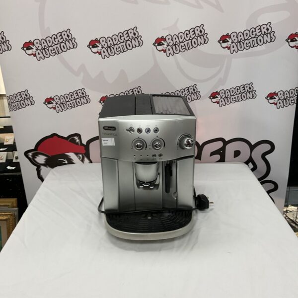 Silver DeLonghi Magnifica coffee machine for brewing espresso at home.