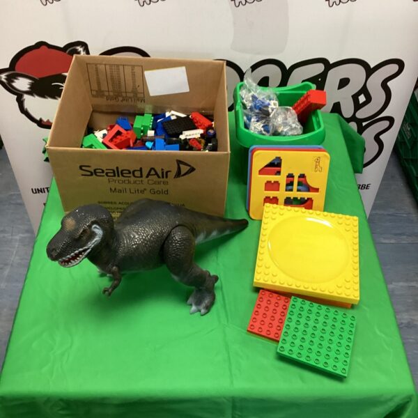 Mixed Duplo Lego and dinosaur toy lot for children.