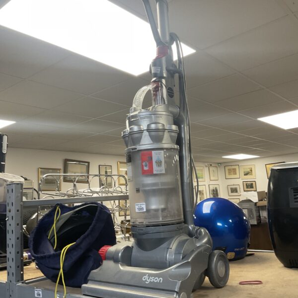 Silver Dyson DC14 upright vacuum cleaner for home cleaning.