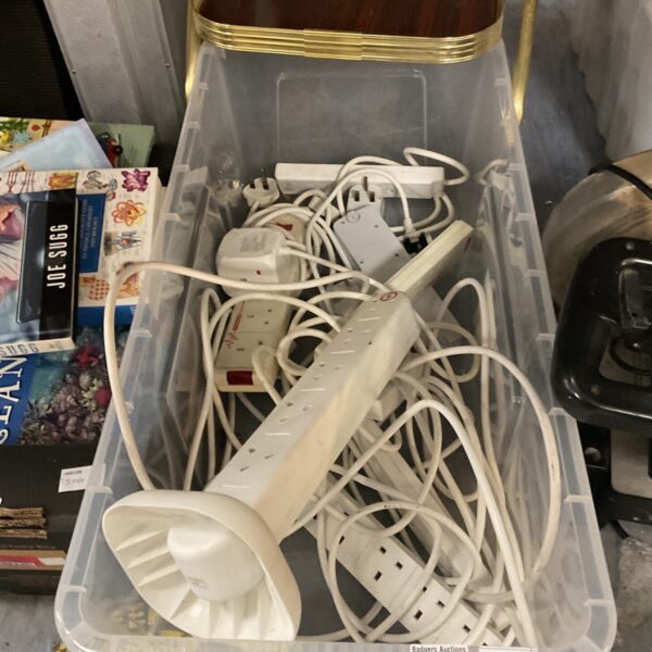 Assorted electrical extension leads in a plastic tray.