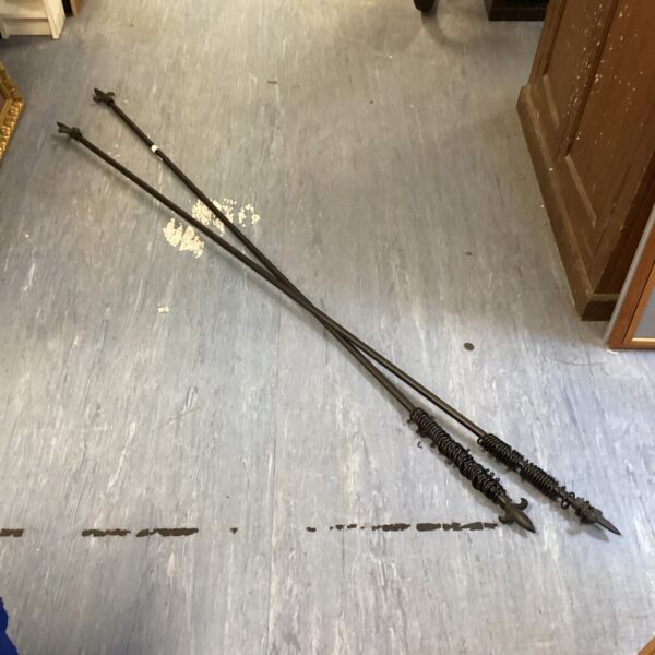 Pair of antique Fleur de Lys black metal curtain rails.
