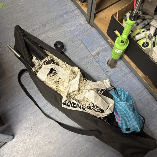 Forza sports net folded in its carry bag, ready for transport.