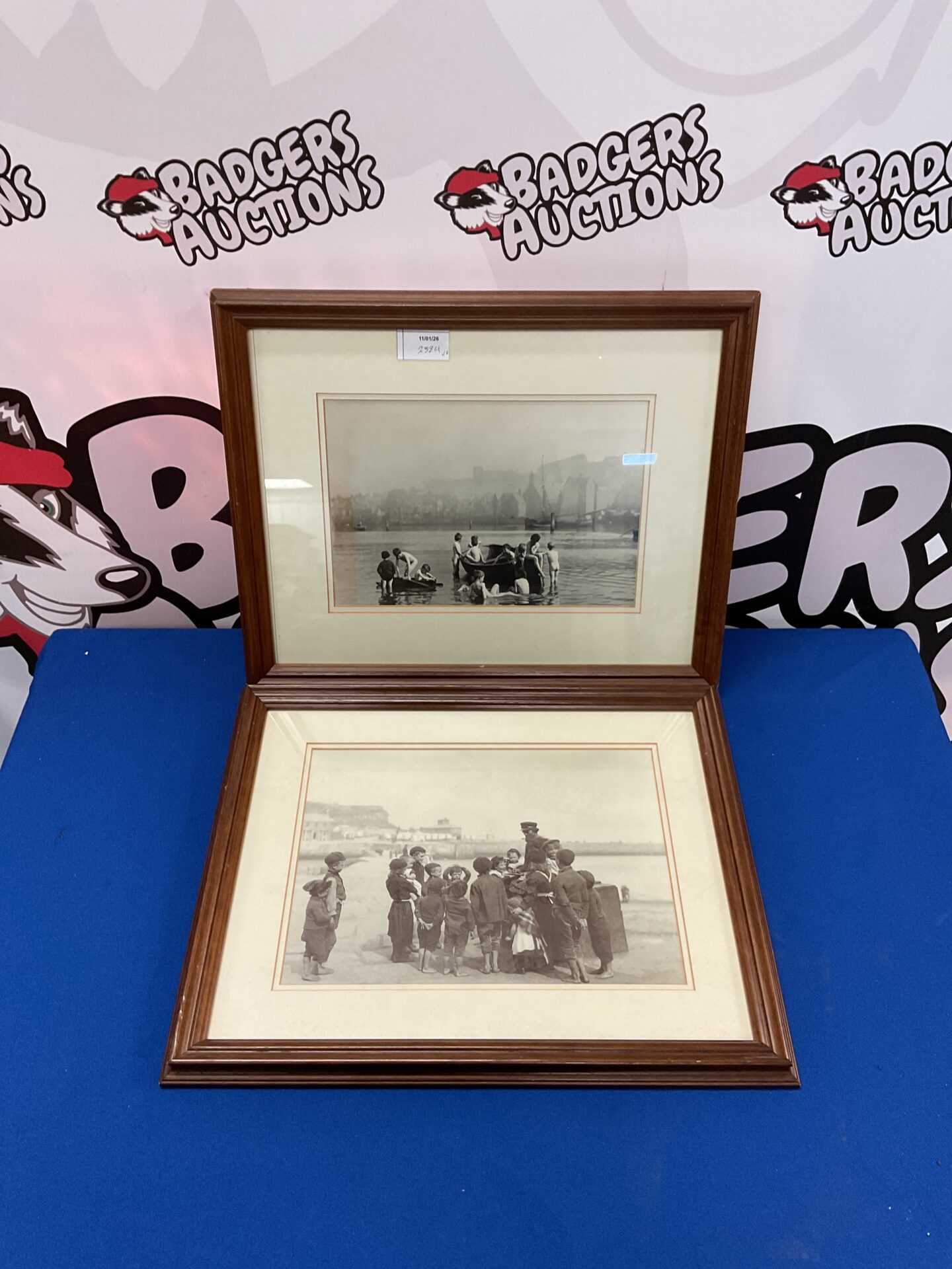 696 Two framed Frank Sutcliffe black-and-white photographs of children on Whitney Beach