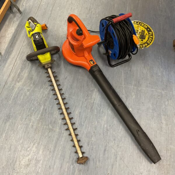 Garden power tools bundle including blower, trimmer, and extension reel.