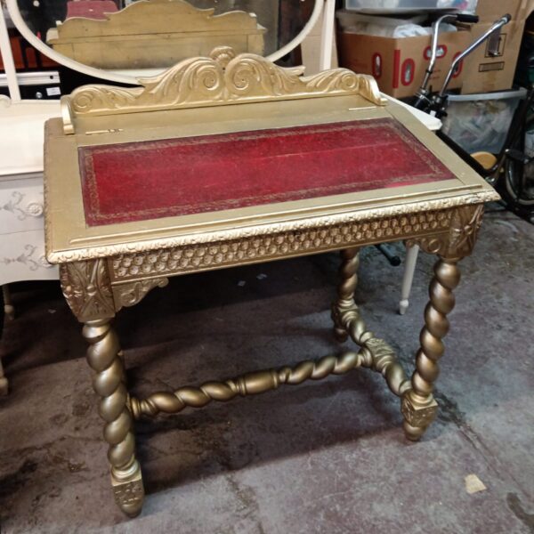 Antique gold barley twist writing desk with leather top.