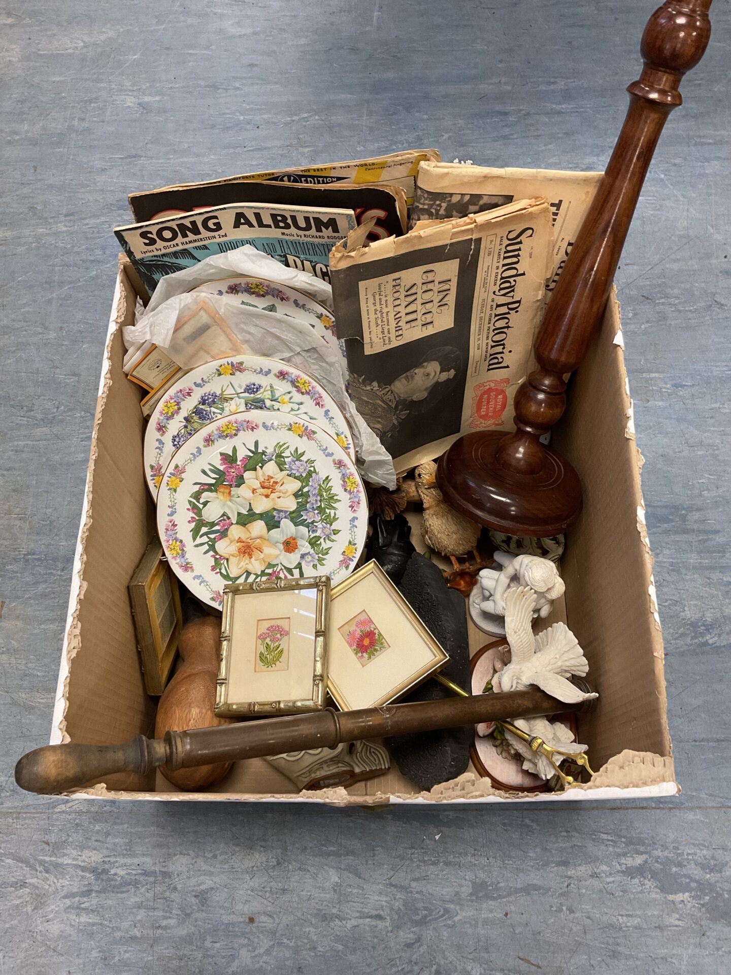 072 Box of animal ornaments, miniature embroideries & king george coronation newspapers