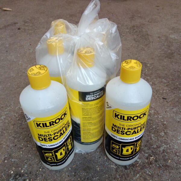 Seven yellow bottles of Killrock descaler for limescale removal.