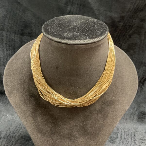 Elegant liquid silver necklace with 14 carat gold plating.