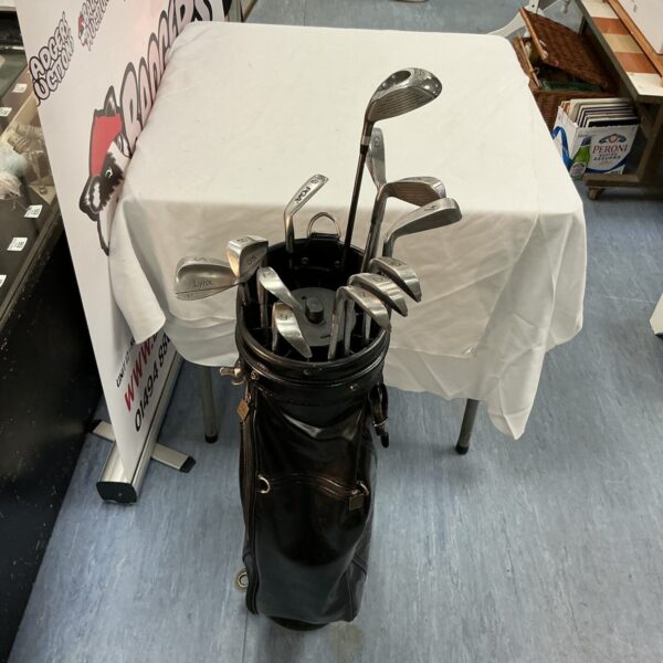 Vintage Lynx golf clubs in a black bag, a complete set.