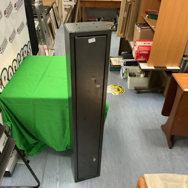 Front view of a metal gun cabinet with a keyed lock.