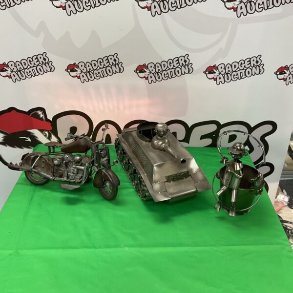 Vintage metal ornaments collection featuring motorbike and fisherman.
