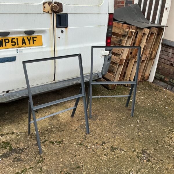 Two metal A-frame sign stands for advertising displays.