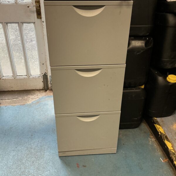 Vintage metal three-drawer cabinet with lock for secure storage.