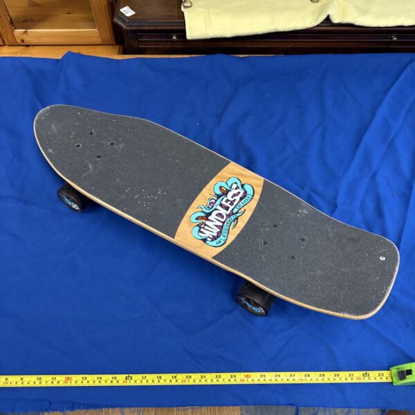 Vibrant Mindless Calamari longboard skateboard with graphic design.
