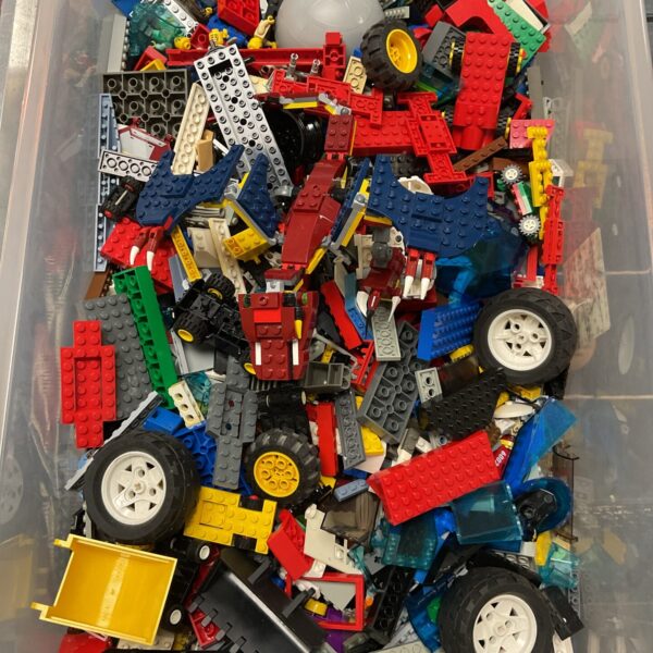 Mixed Lego lot with colourful bricks and minifigures.