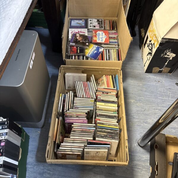 Two boxes filled with a large Music CD collection.