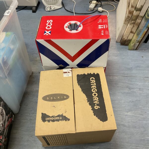 Belkin network cable reels in a cardboard box.