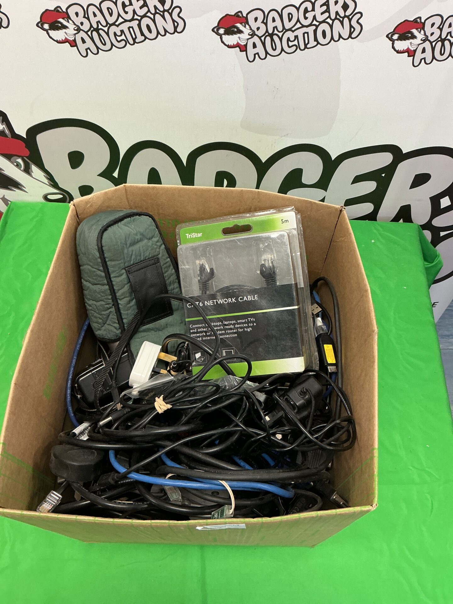 216 Box of mixed electricals including cables, power supplies, cameras, and other