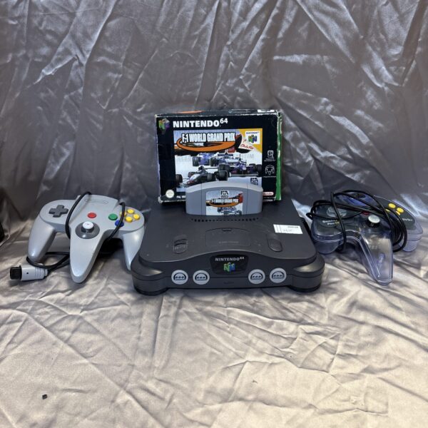 Nintendo 64 console with controllers and boxed game for retro gaming.