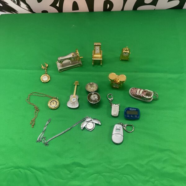 Assortment of miniature novelty clocks, including guitar and drum styles.