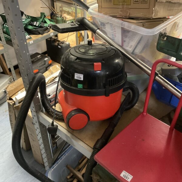 Red Numatic Henry Hoover with extension pole, used condition.