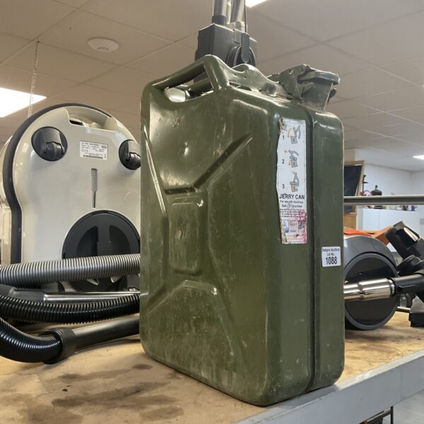 Olive green metal Jerry Can for fuel or liquid storage.