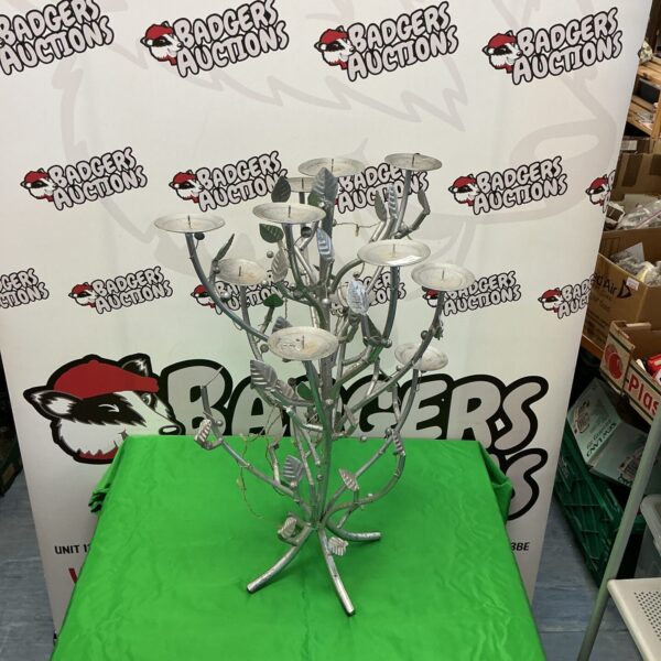 Ornate silver candelabra with multiple arms for candles.