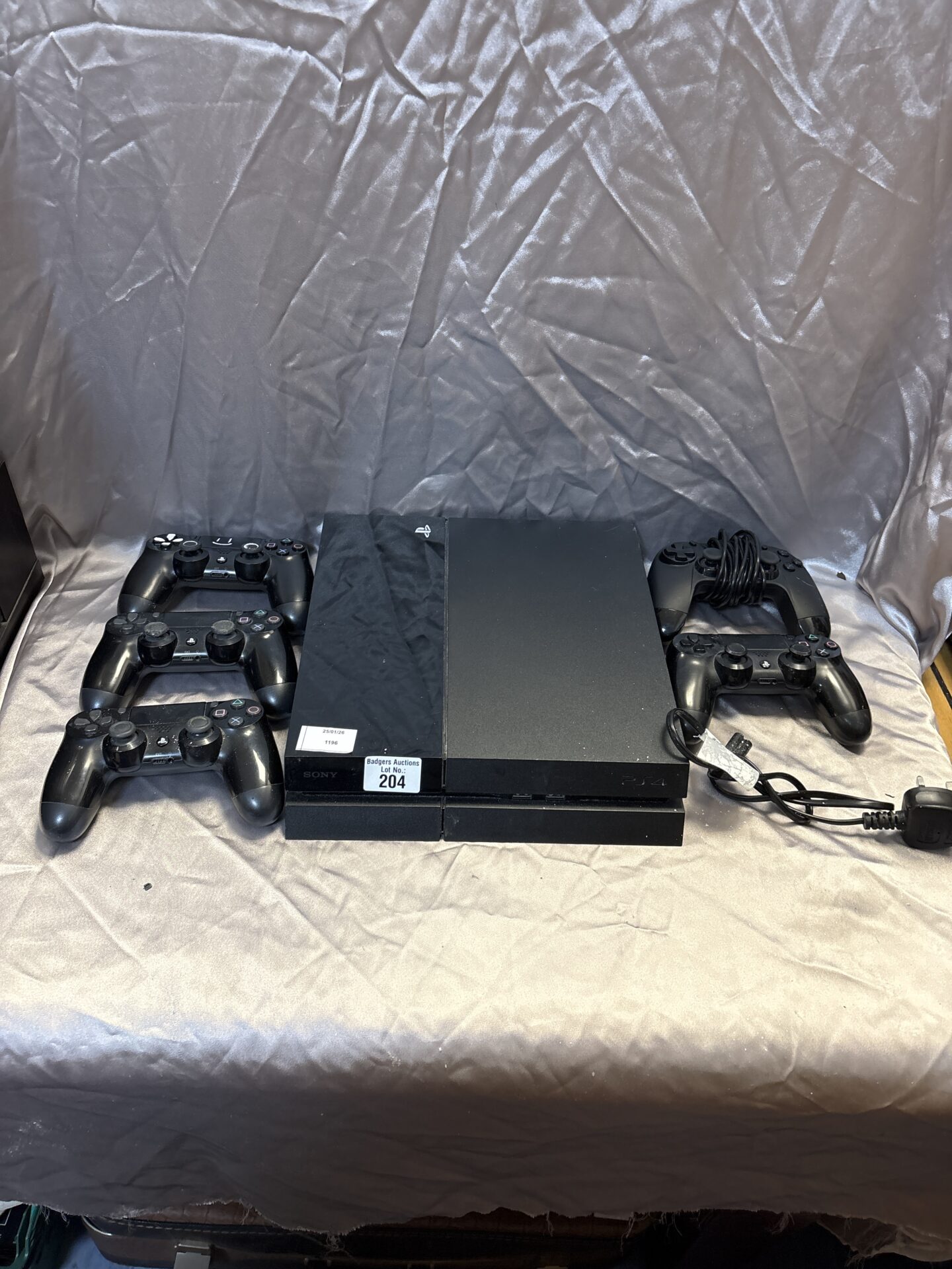 204 Sony PlayStation four console with five controllers