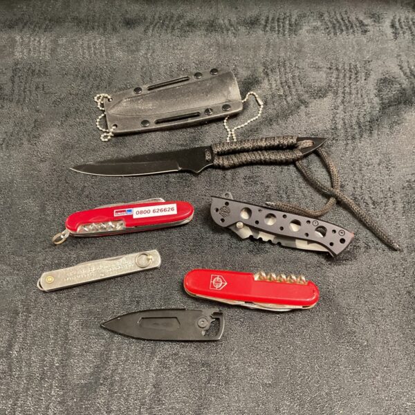 Vintage pocket knife lot with folding and fixed blade knives.