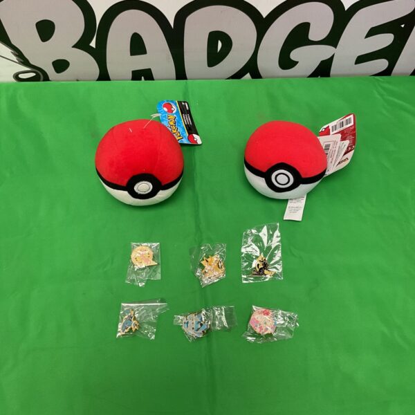 Pokemon plush Pokeballs and badges lot for collectors.