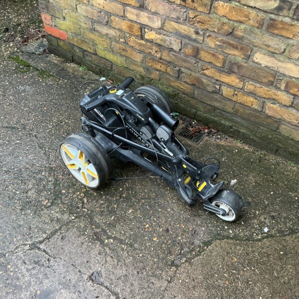 Used Power Caddy golf cart with battery and charger.