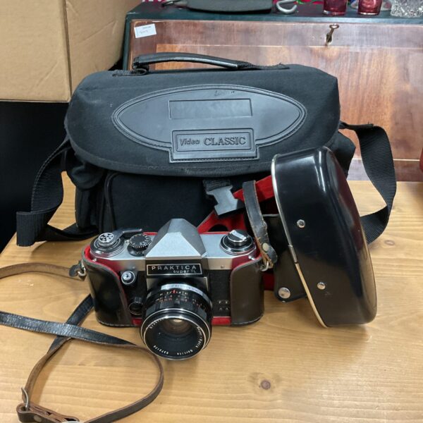 Vintage Praktica Super TL camera with carrying bag for film photography.