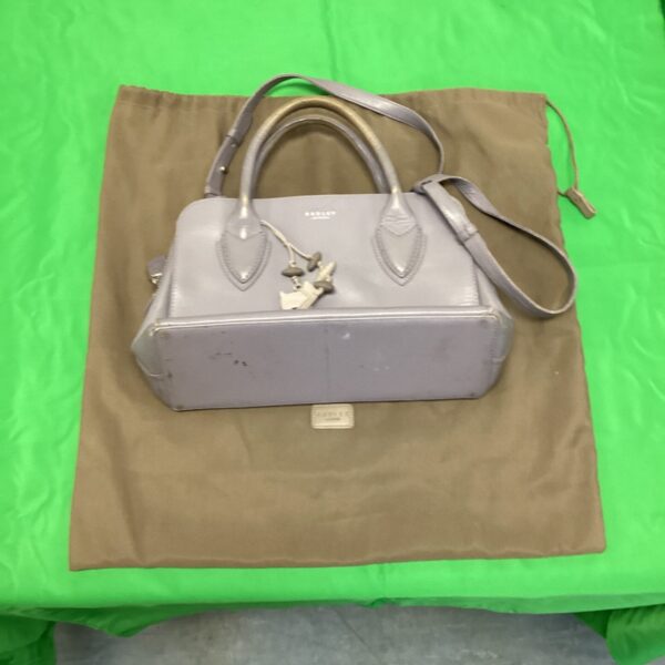Blue leather Radley handbag with signature Scottie dog charm.