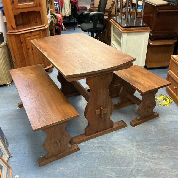 Rustic pine refectory table with turned legs, ideal for farmhouse dining.