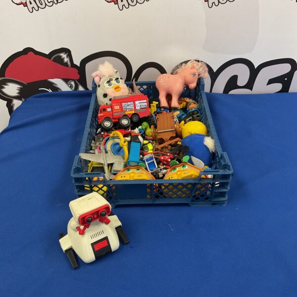Overview of a retro toy lot including Furby and Tomy Robo.