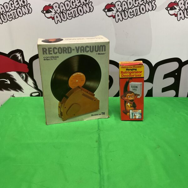 Vintage Ronco record vacuum and Melvin the Monkey deodorizer.