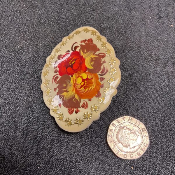 Vintage Russian hand painted floral brooch, detailed enamel work.