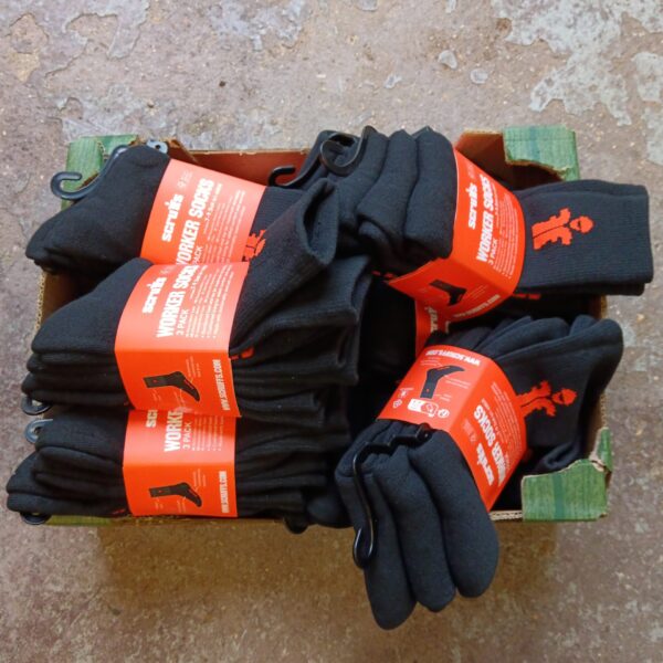 Lot of new black Scruffs worker socks in packaging.