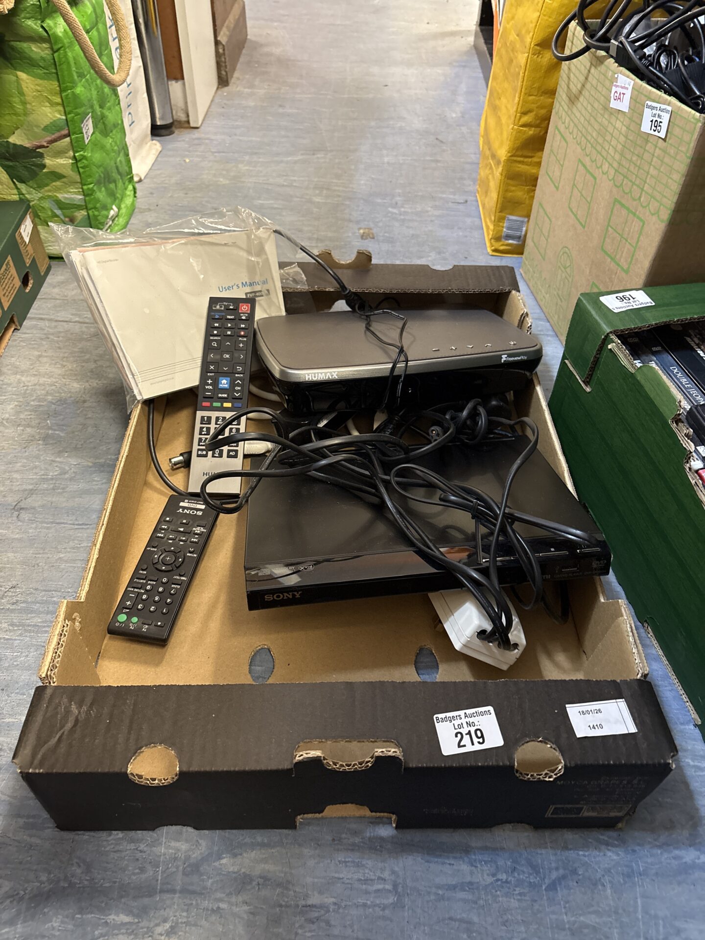 219 Box containing Sony dvd player and humax freeviewplay with remotes