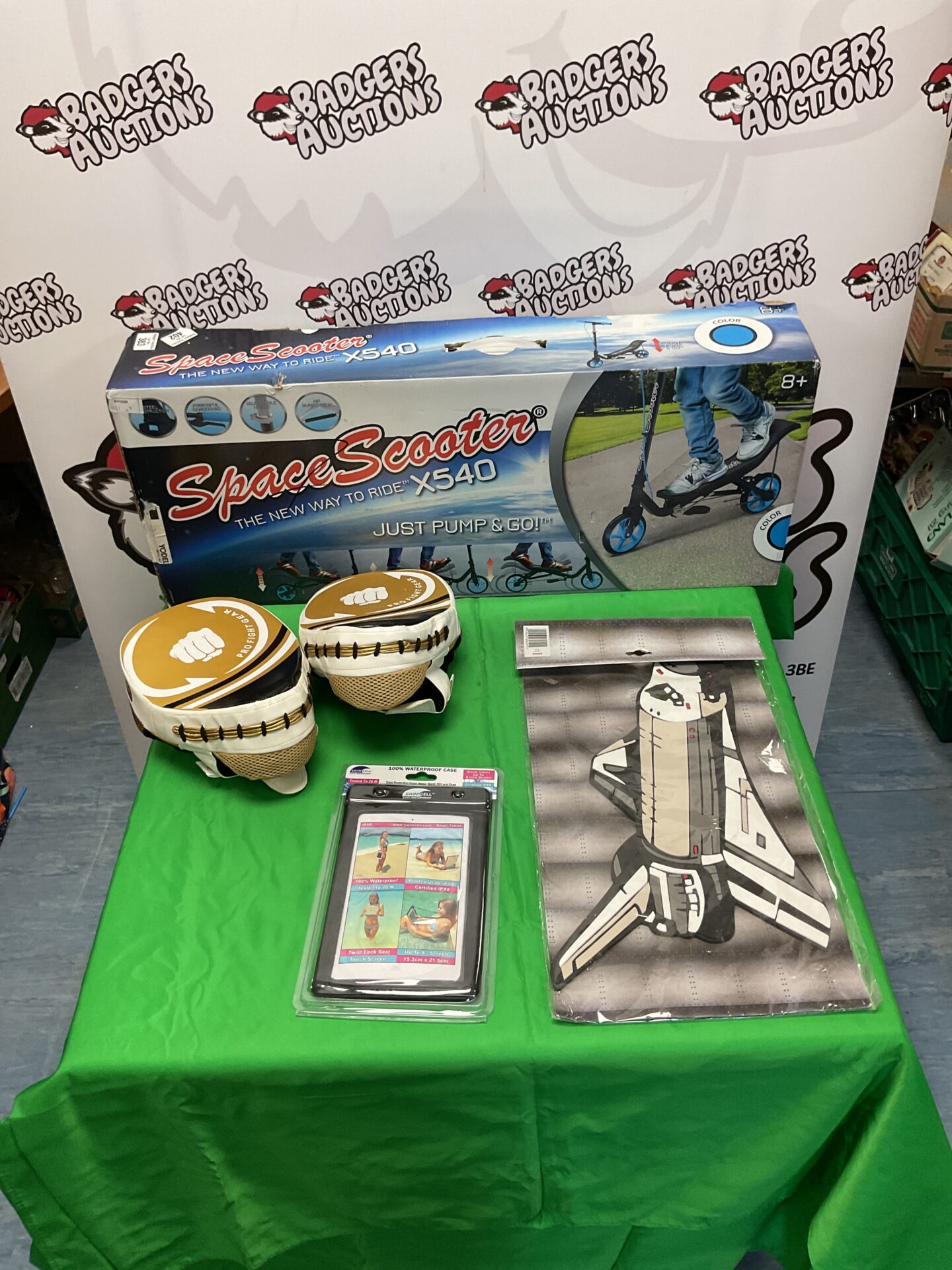 402 Space Scooter X540 scooter, boxing pads, waterproof tablet case, and Apollo foam figure