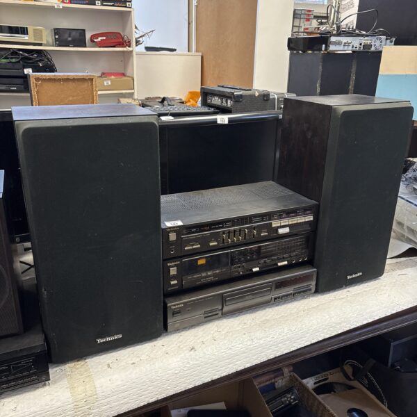 Vintage Technics hi-fi system with amplifier, cassette deck, and speakers.