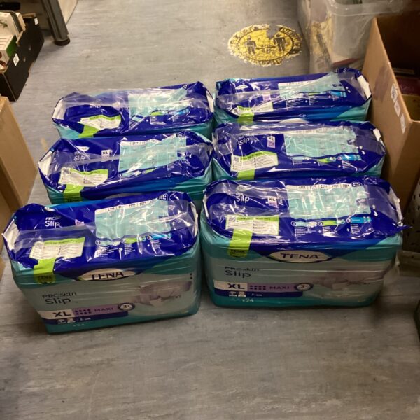 Six unopened packs of Tena Pants XL Maxi incontinence underwear.