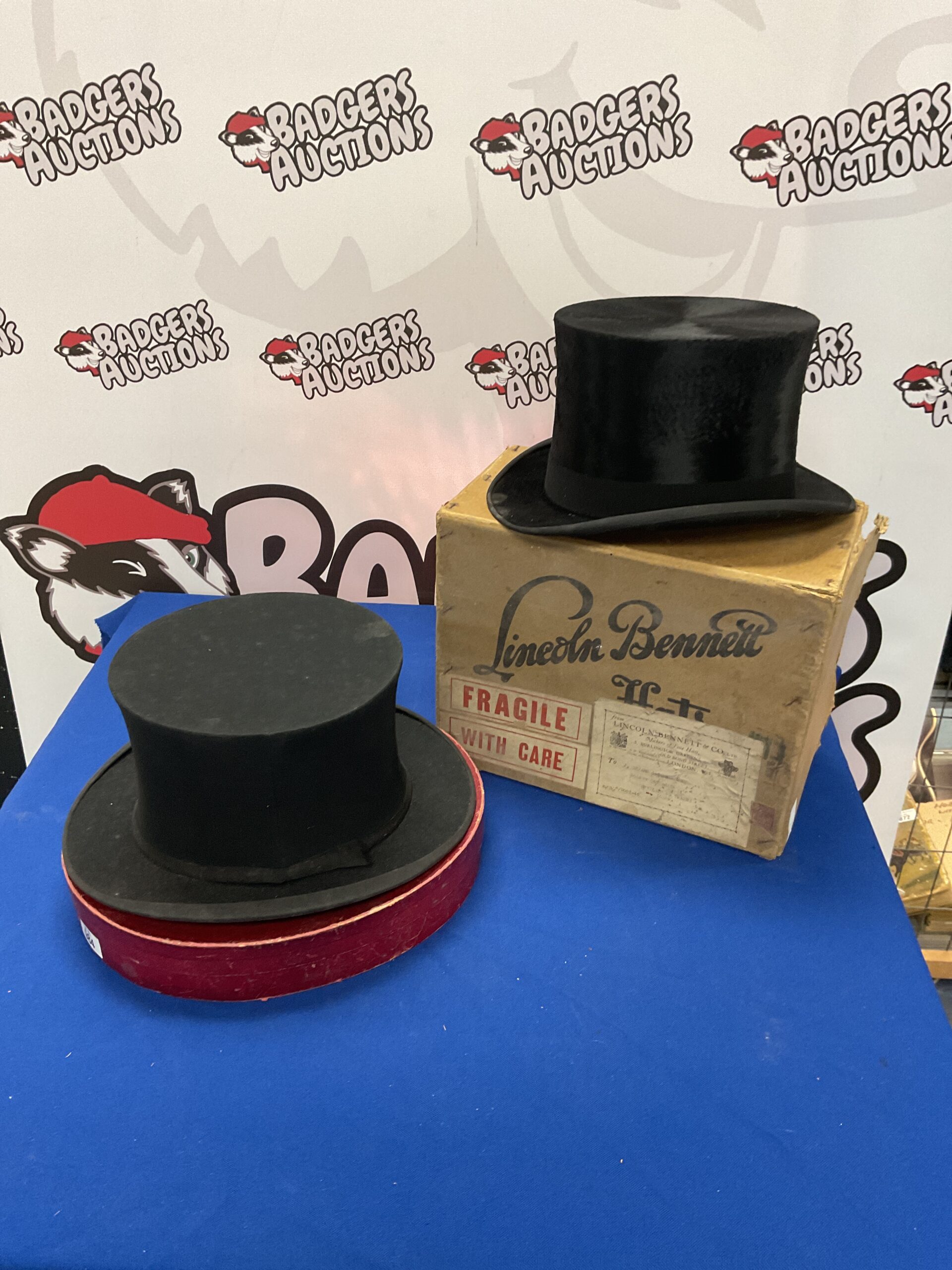984 Two Victorian top hats, one collapsible and one in original box from Lincoln Bennett hats Burlington Gardens, old Bond Street, London