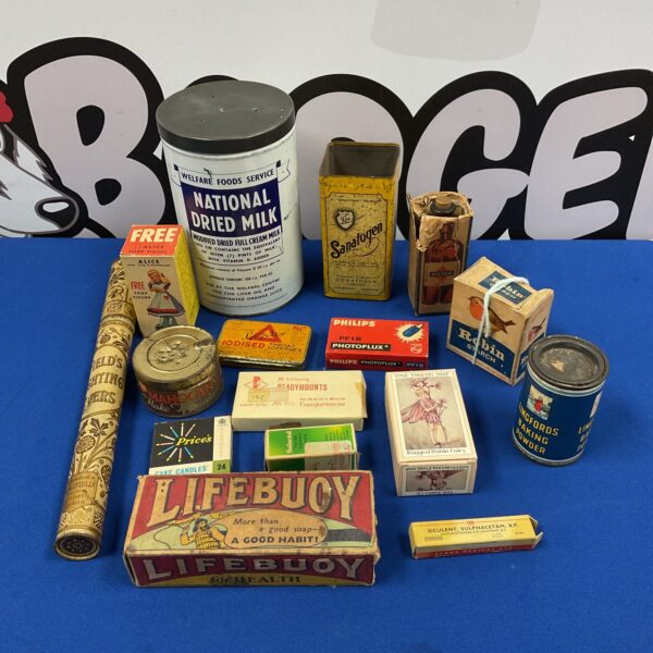 Assorted vintage advertising tins, colourful metal packaging, collectible ephemera.