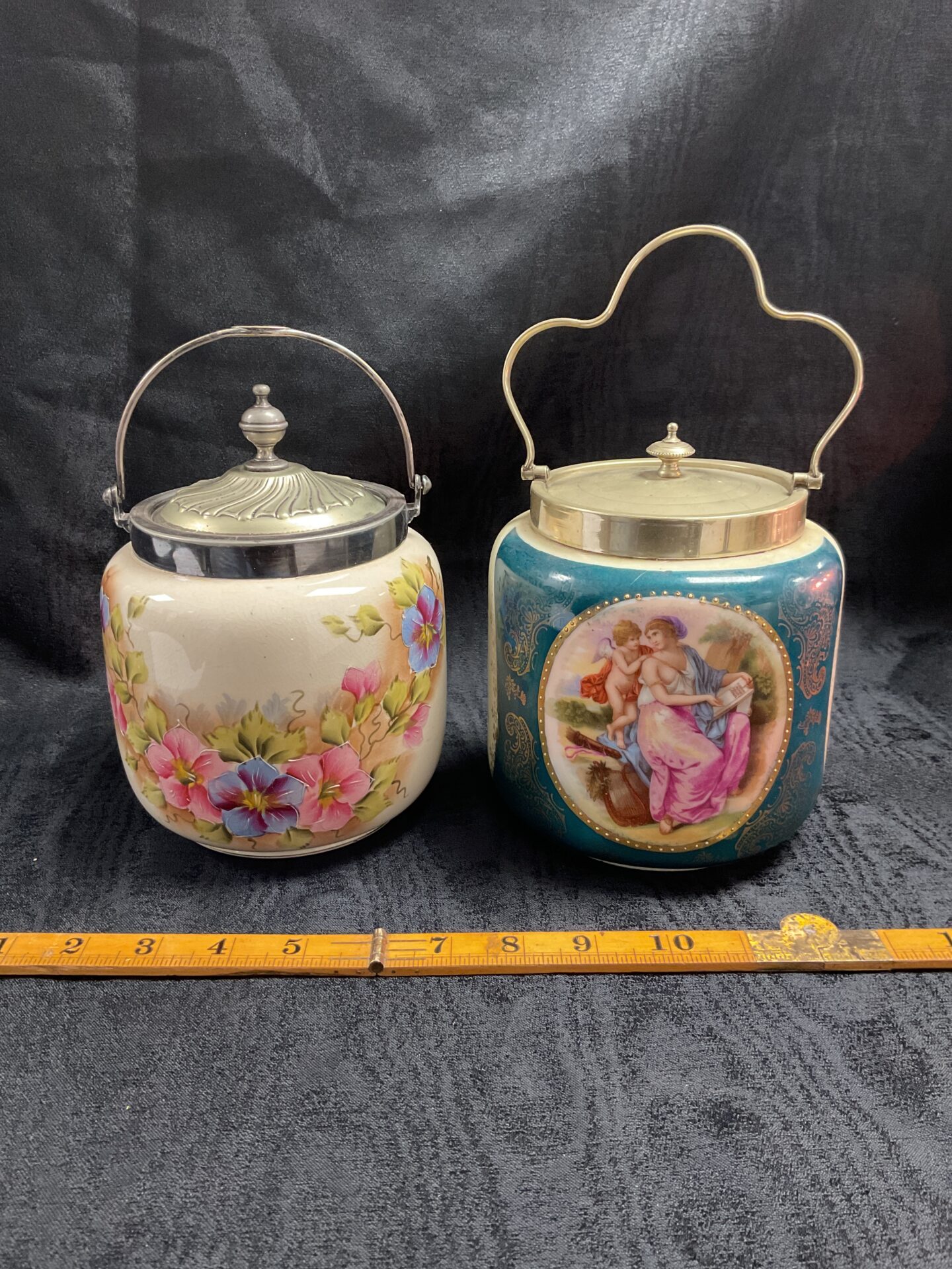322 Two 1930s ceramic biscuit jars with silver plate lids and handles