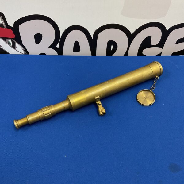 Antique brass telescope with a protective outer tube.